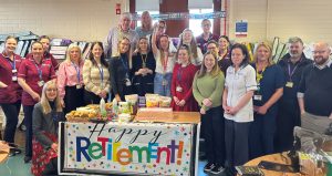 Staff from Northern Ireland Cancer Trials Network with celebration cake